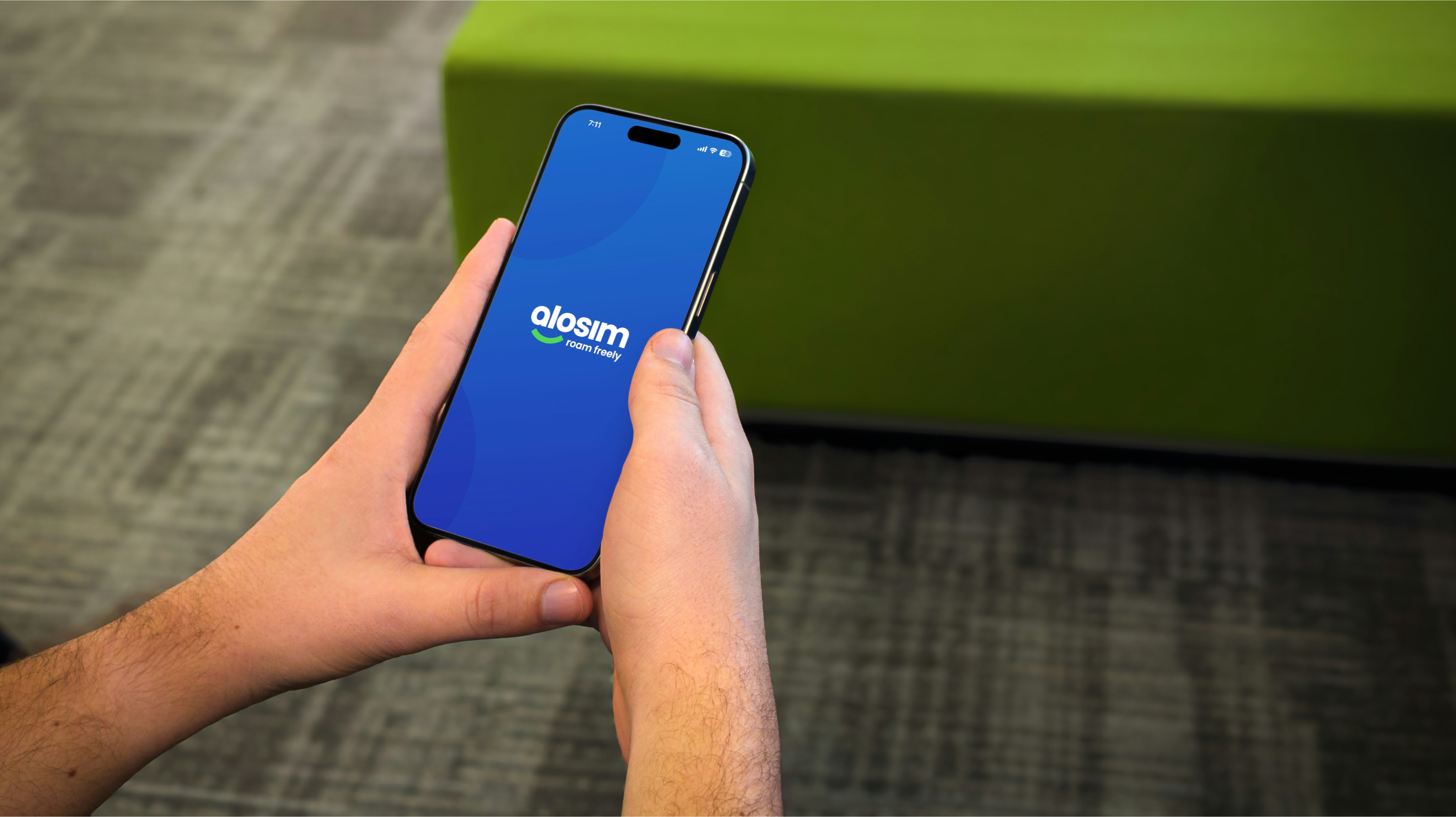 A person holds a phone with an app open.