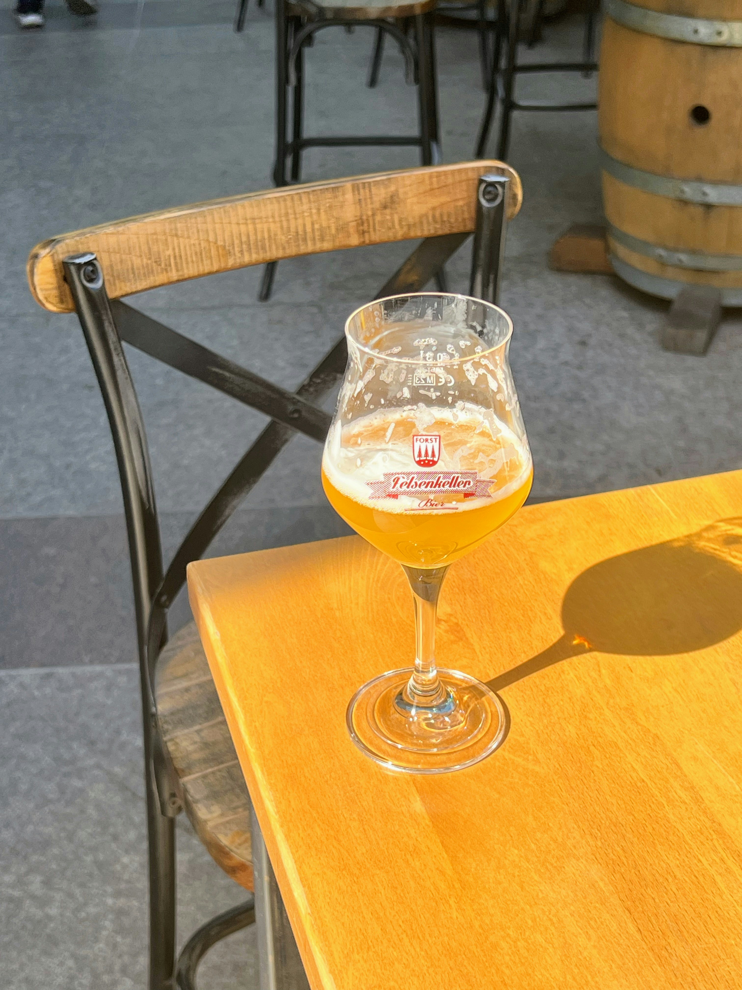 Beer is served on a wooden table.