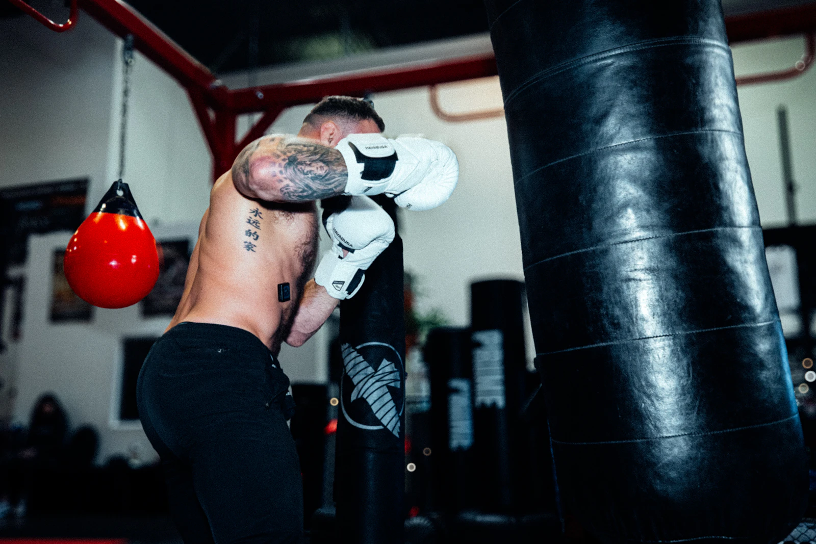 A fighter working conditioning rounds on a heavy bag