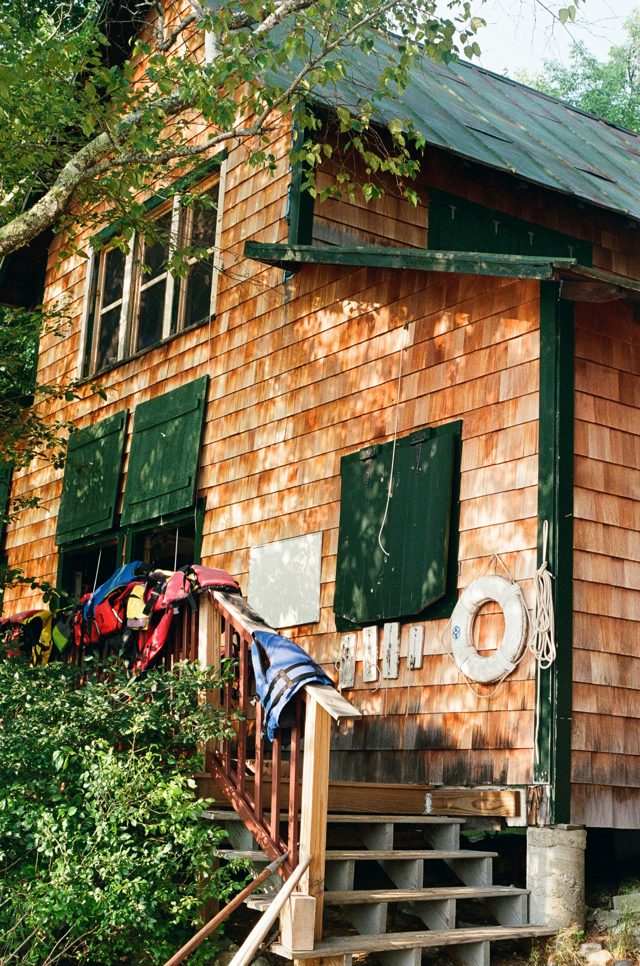 A wooden cabin with nautical decorations.