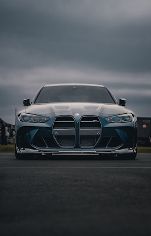 A blue BMW m3 looks powerful and ready.