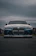 A blue BMW m3 looks powerful and ready.