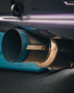 Car exhaust pipe is shown up close.