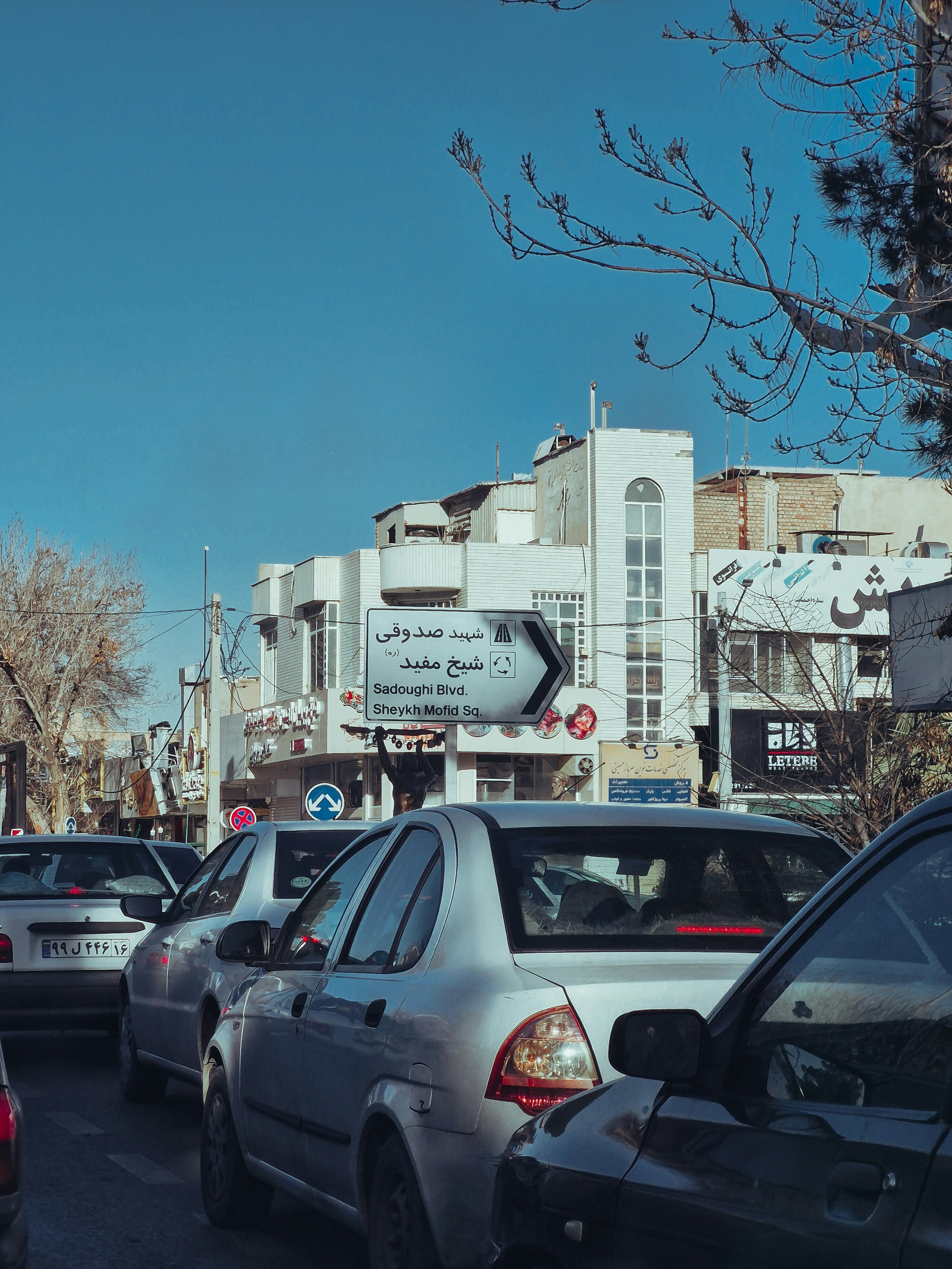 Traffic jams on a city street with buildings.
