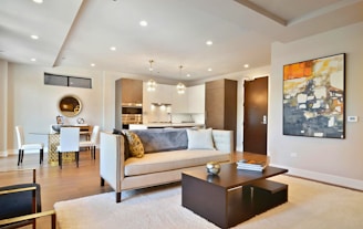 Modern, stylish living room with open concept kitchen.