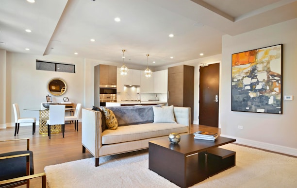 Modern, stylish living room with open concept kitchen.