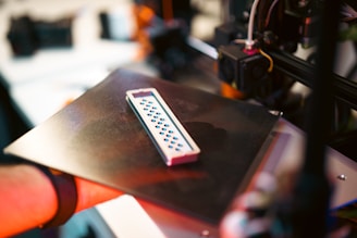 A 3d-printed object sits on the printer.