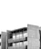 Concrete building with many windows and balconies.