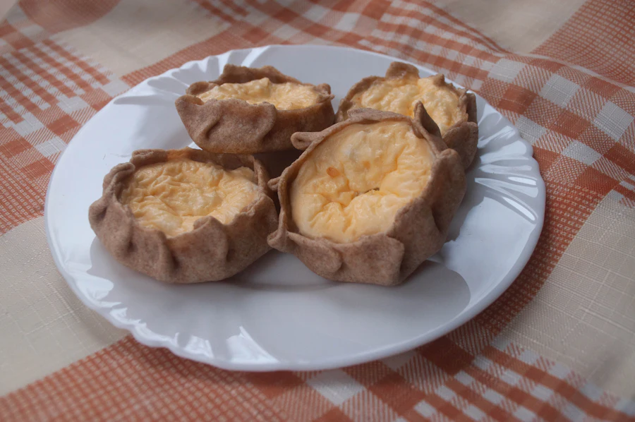 Karelian pastries with rye crusts and rice filling on a white plate