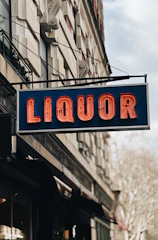 Liquor store sign with neon lights.