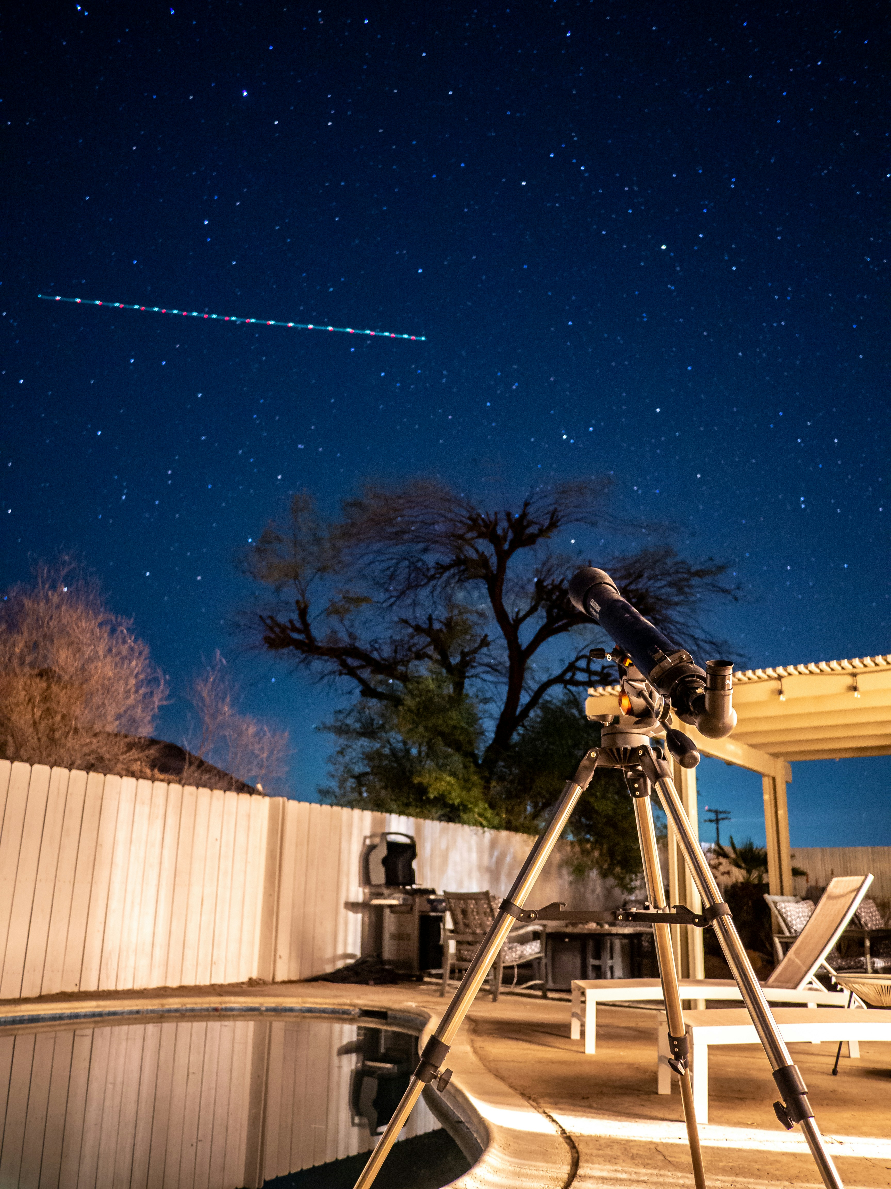 Telescope observing the stars in a stunning night sky