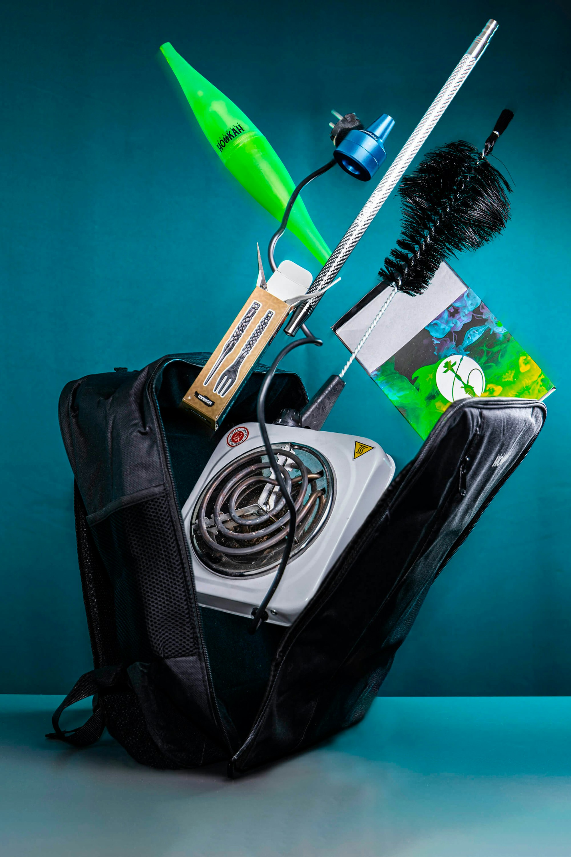 Hookah equipment and electric burner come out of the bag.