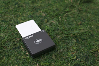 Credit card reader on moss, ready for use.