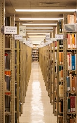 A long library aisle lined with books.