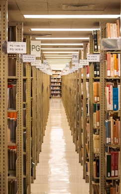 A long library aisle lined with books.