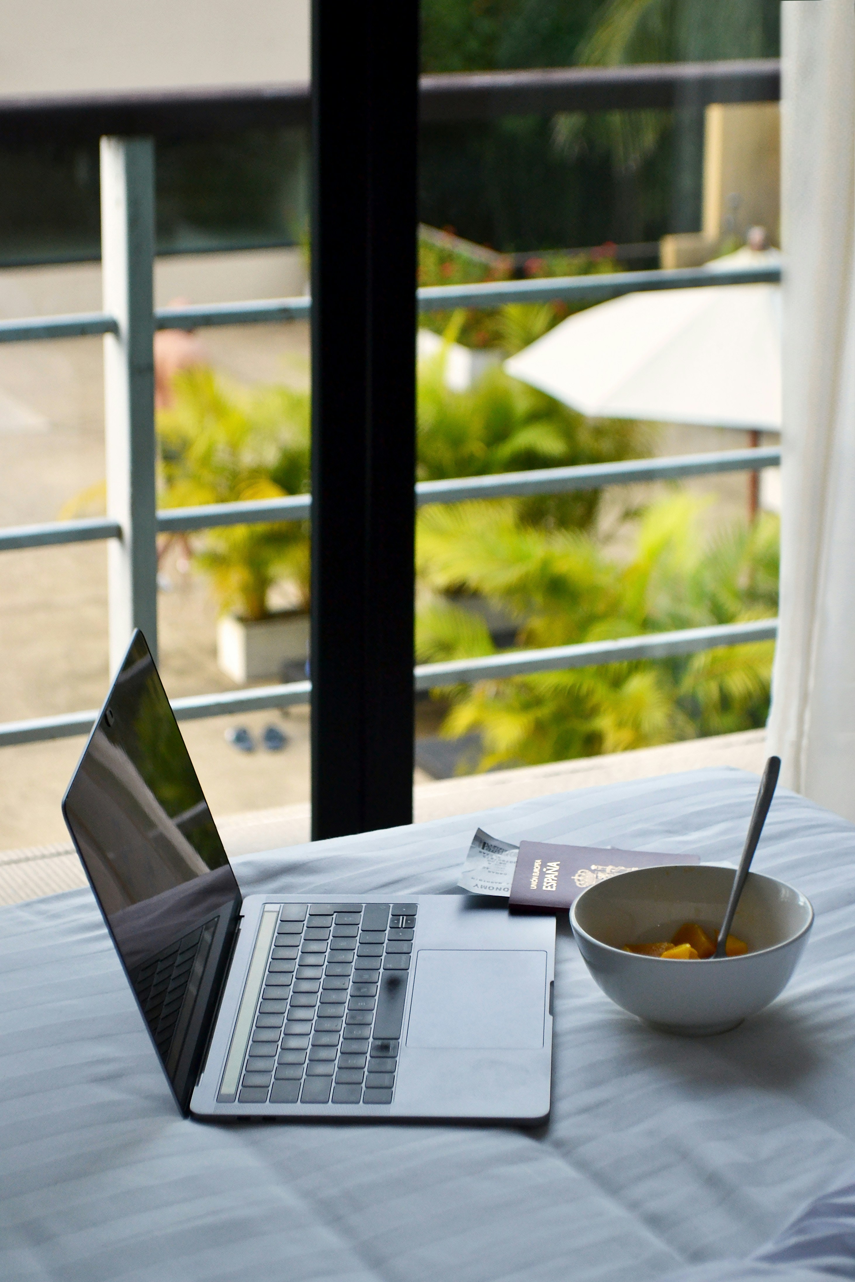 Digital nomad working remotely with a global map and travel context