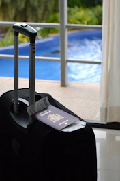 Ready for a trip: suitcase, passport, and tickets.