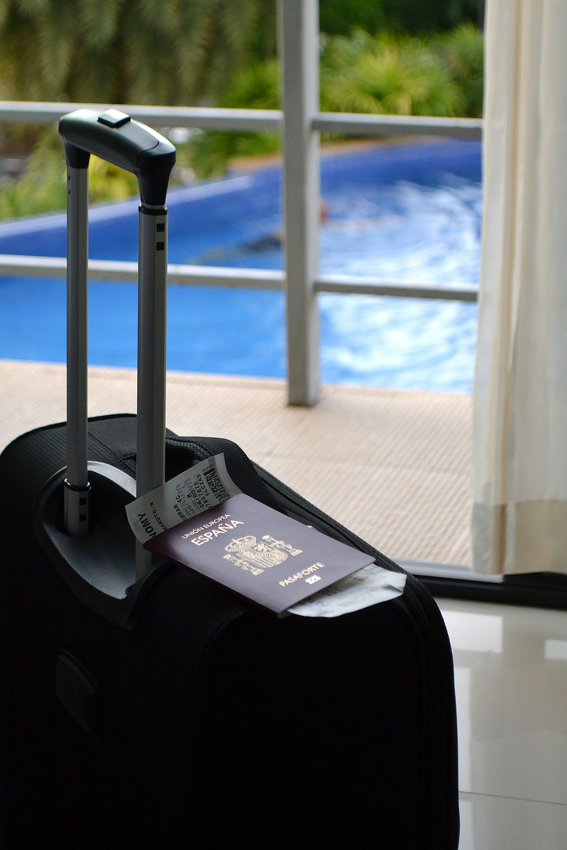 Ready for a trip: suitcase, passport, and tickets.