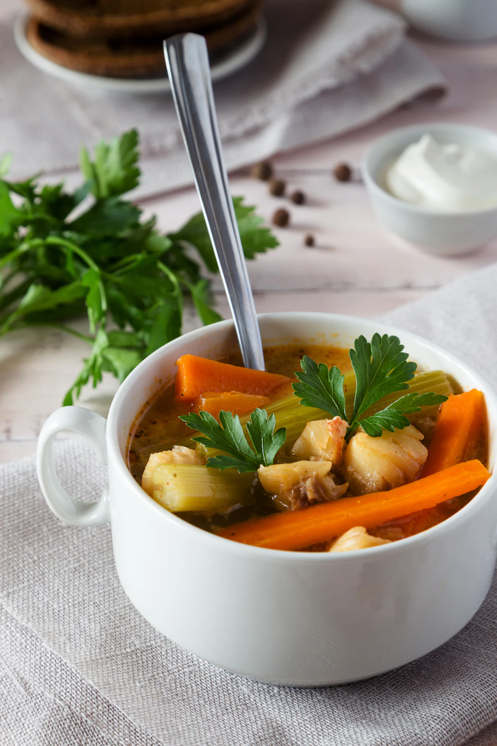 Bowl of warm Farro and vegetable soup with carrots and celery