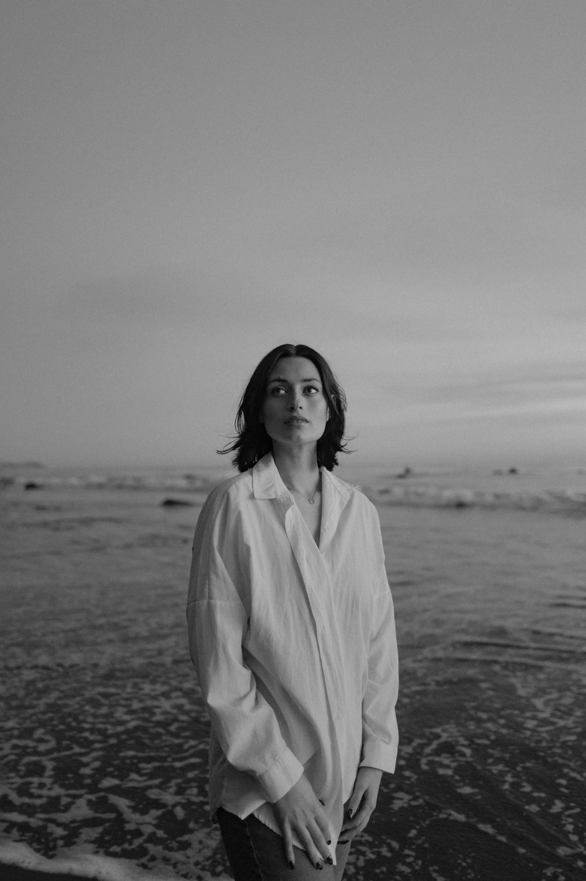 A woman in a sculptural white shirt — the neo-minimalist reinvention