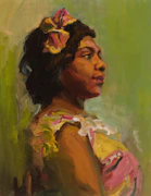 Portrait of a woman with a floral hair accessory.