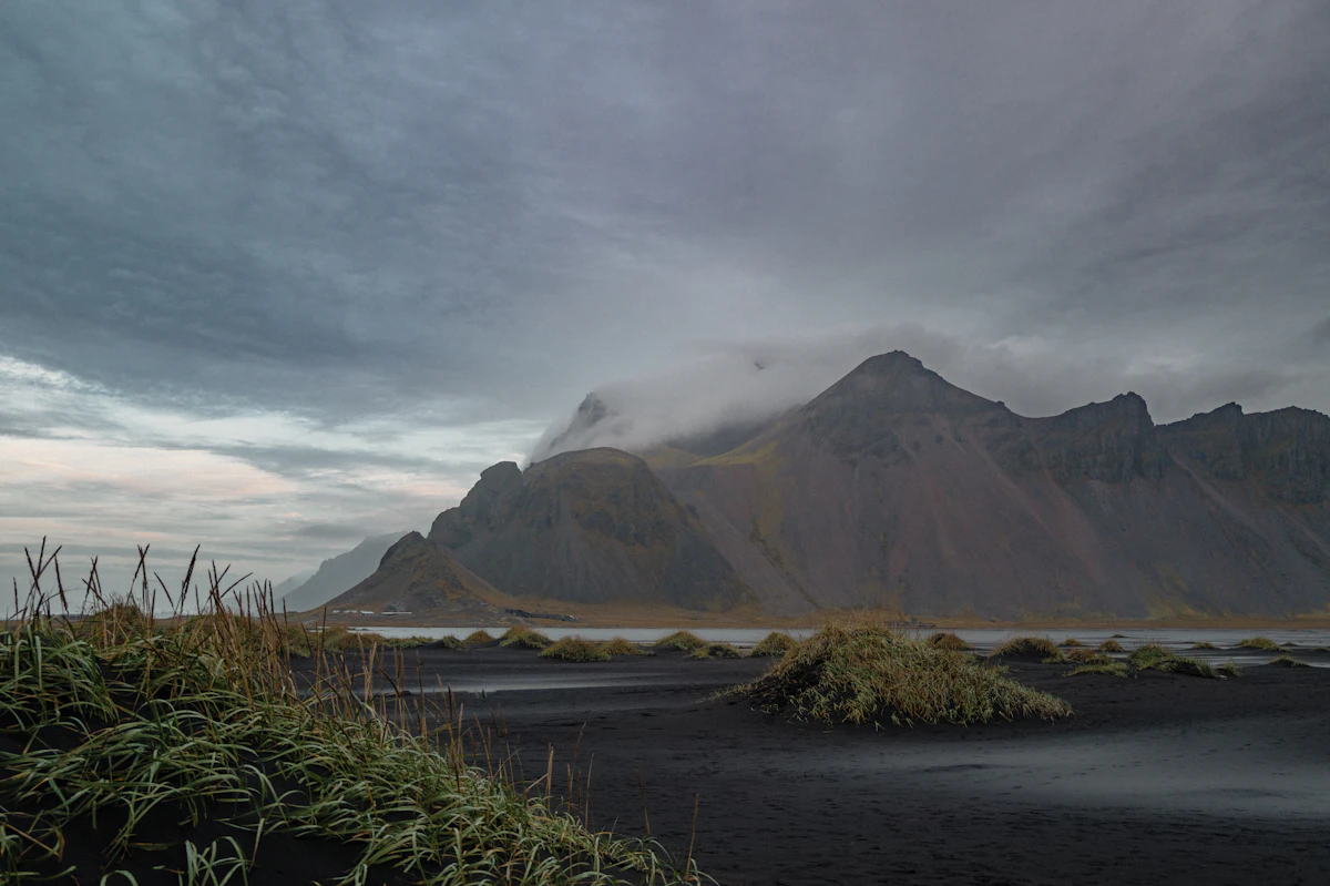 Dramatic mountains under a cloudy, moody sky