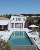 Luxury villa with pool on a sunny day.