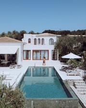 Luxury villa with pool on a sunny day.