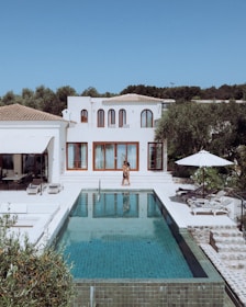 Luxury villa with pool on a sunny day.