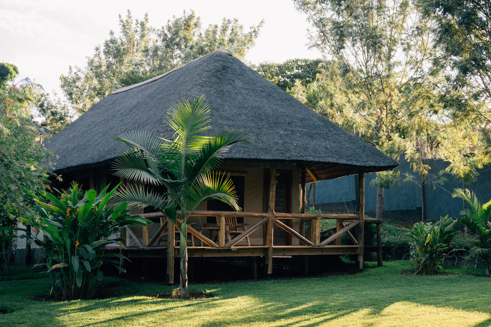 Thatched safari bungalow in green grounds