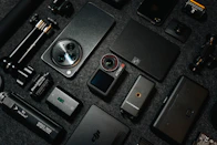 Camera gear and gadgets are neatly arranged.