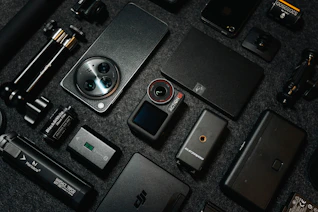 Camera gear and gadgets are neatly arranged.