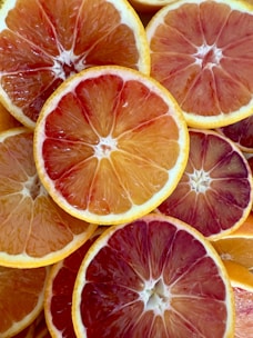 Slices of colorful blood oranges are displayed.