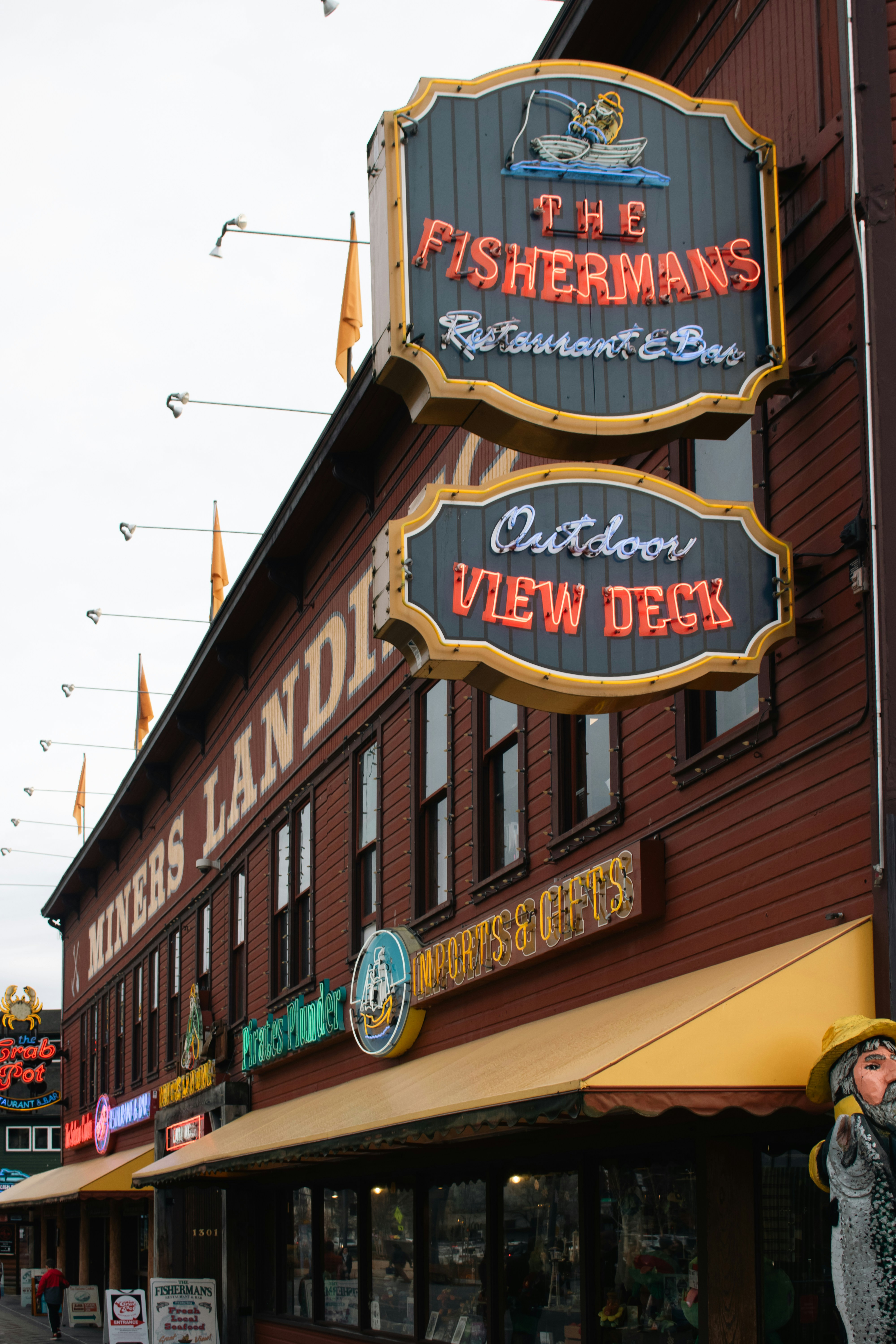 The fisherman's restaurant sign is shown. photo – Free