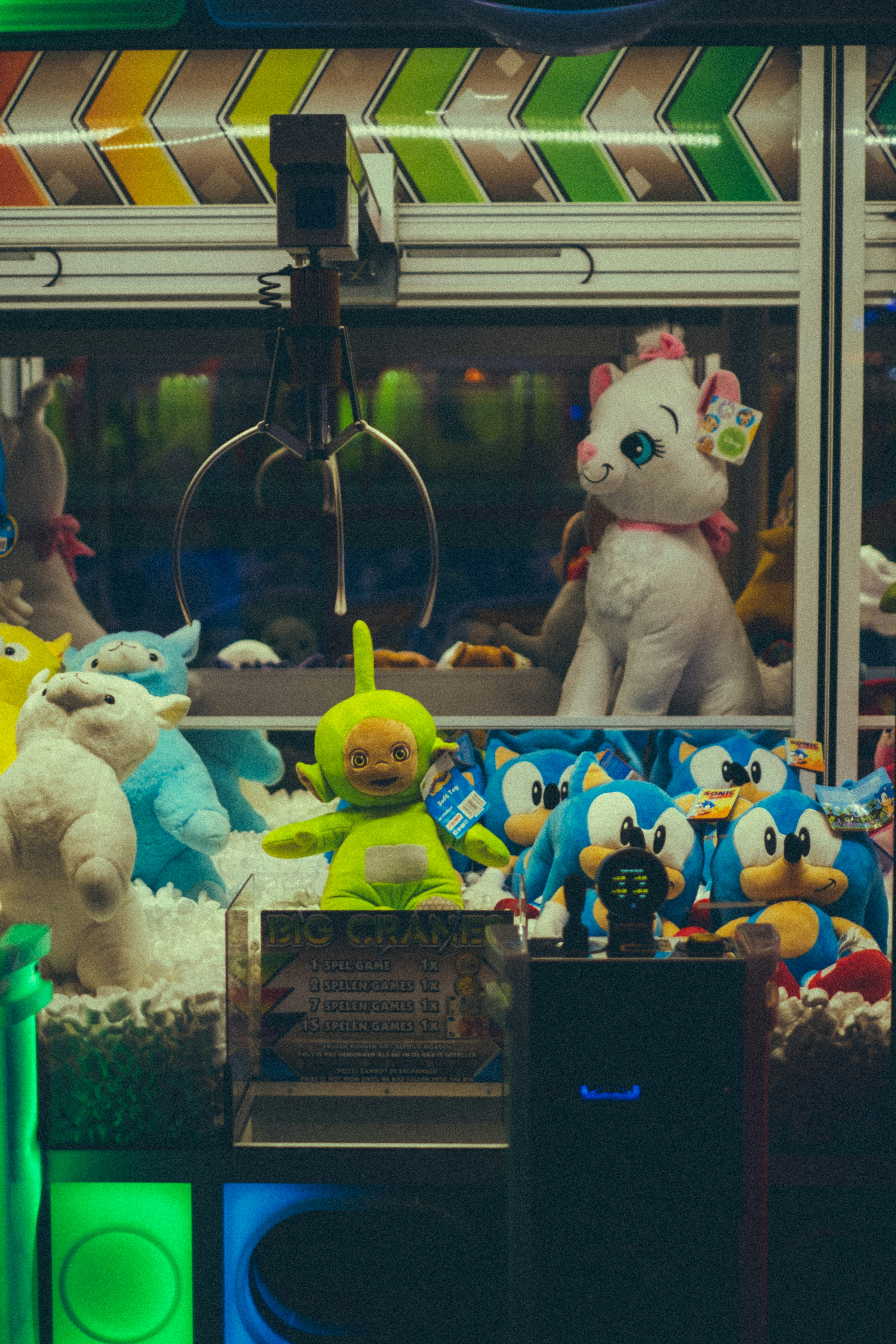 A claw machine filled with stuffed toys.