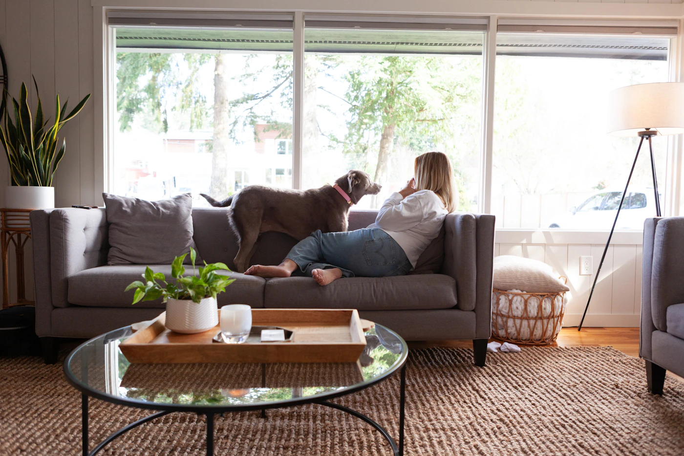 Woman relaxing at home with her dog