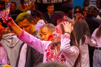 People celebrating the festival of colours in Nepal with vibrant powders and joyful energy
