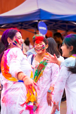 People celebrate holi with colorful powder and laughter.