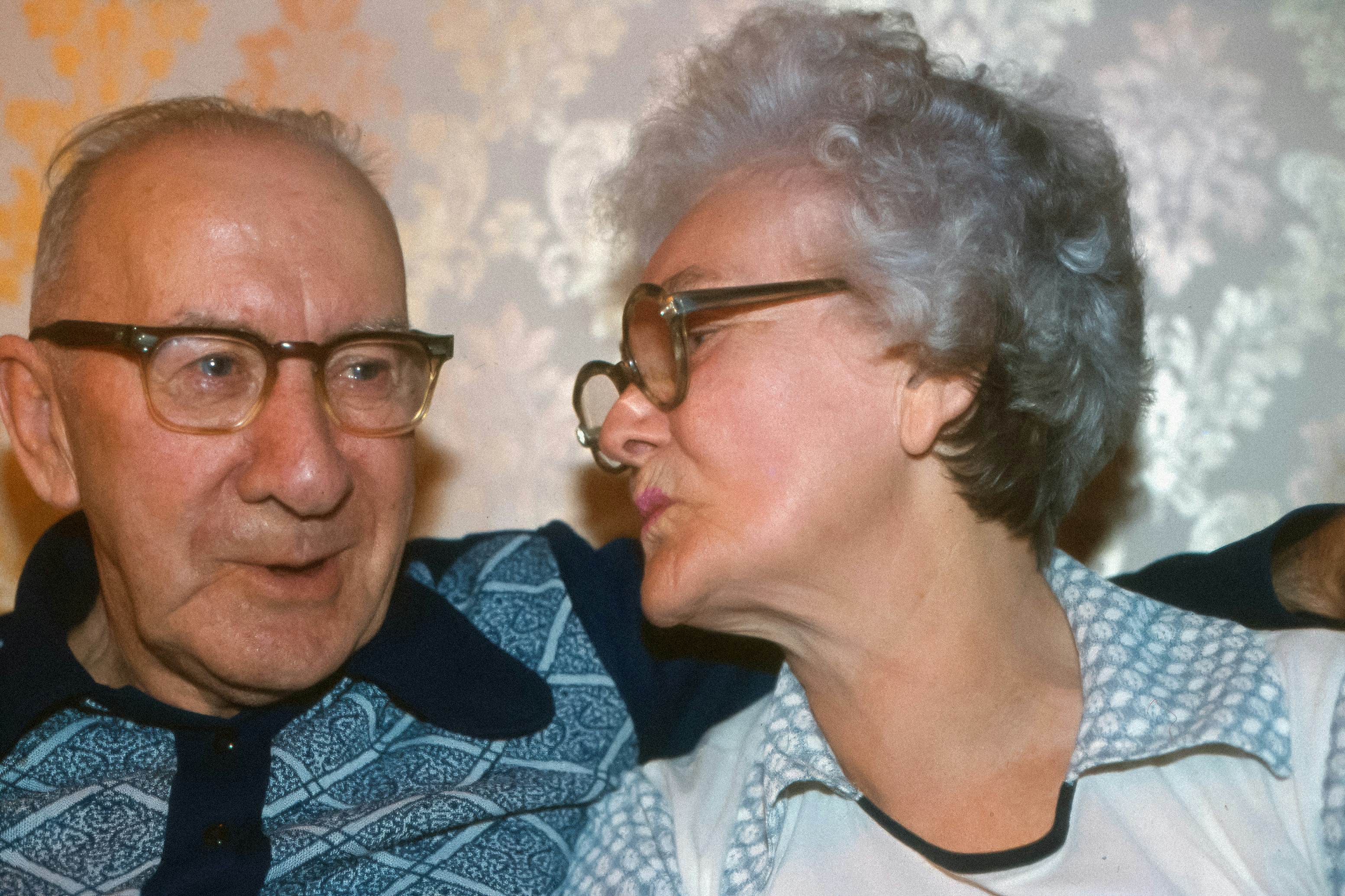 Elderly couple looking at each other