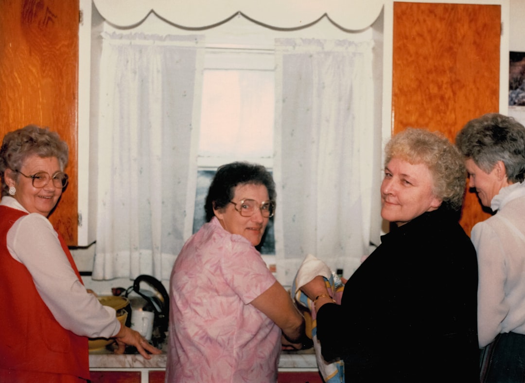 A caregiver assisting a senior with daily tasks in a bright Pittsburgh kitchen - home health care agencies in pittsburgh A caregiver assisting a senior with daily tasks in a bright Pittsburgh kitchen - home health care agencies in pittsburgh