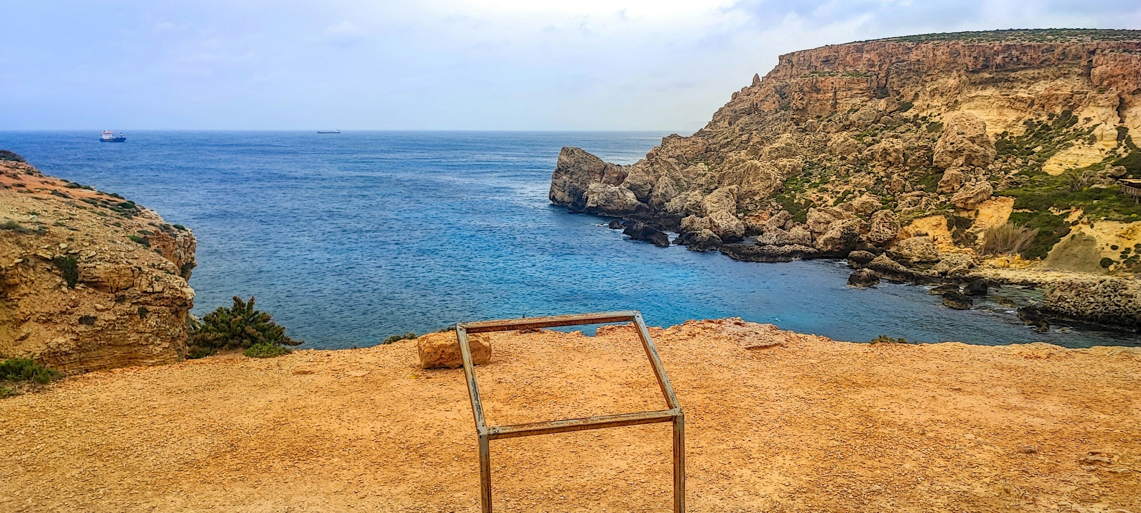Rocky cliffs surround a beautiful ocean bay.