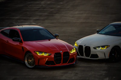 Two BMW m4 sports cars side by side.
