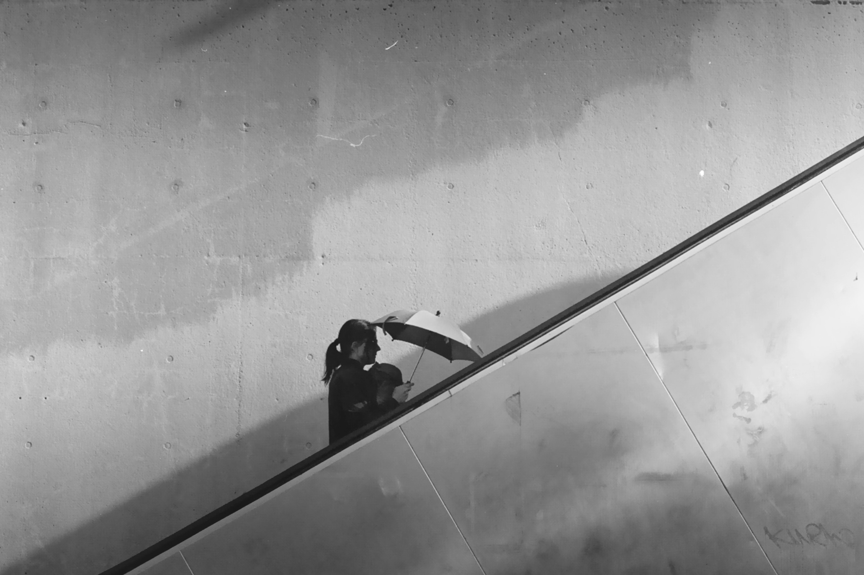 A person slides down a ramp.