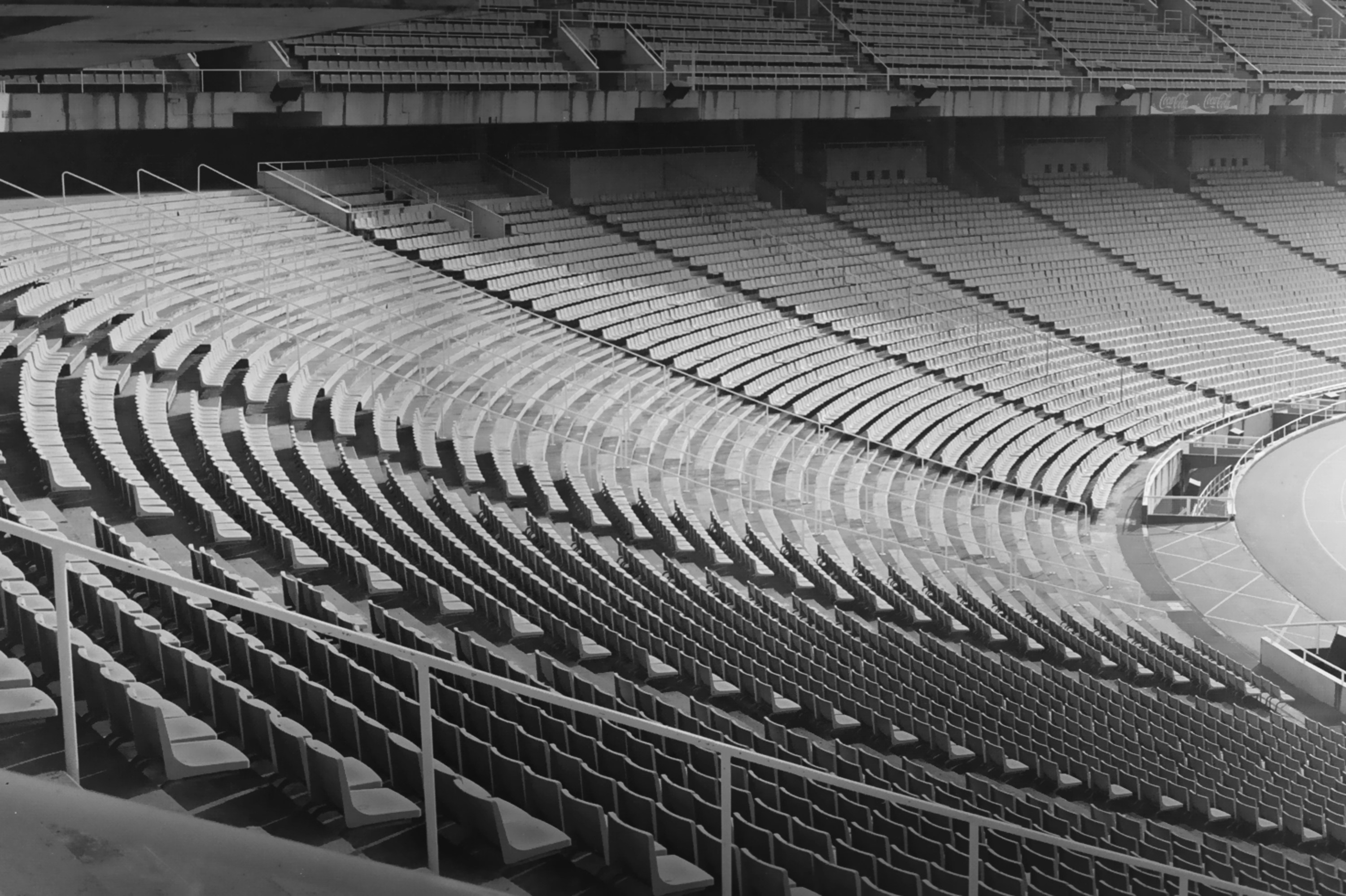 Empty stadium seats arranged in a row.