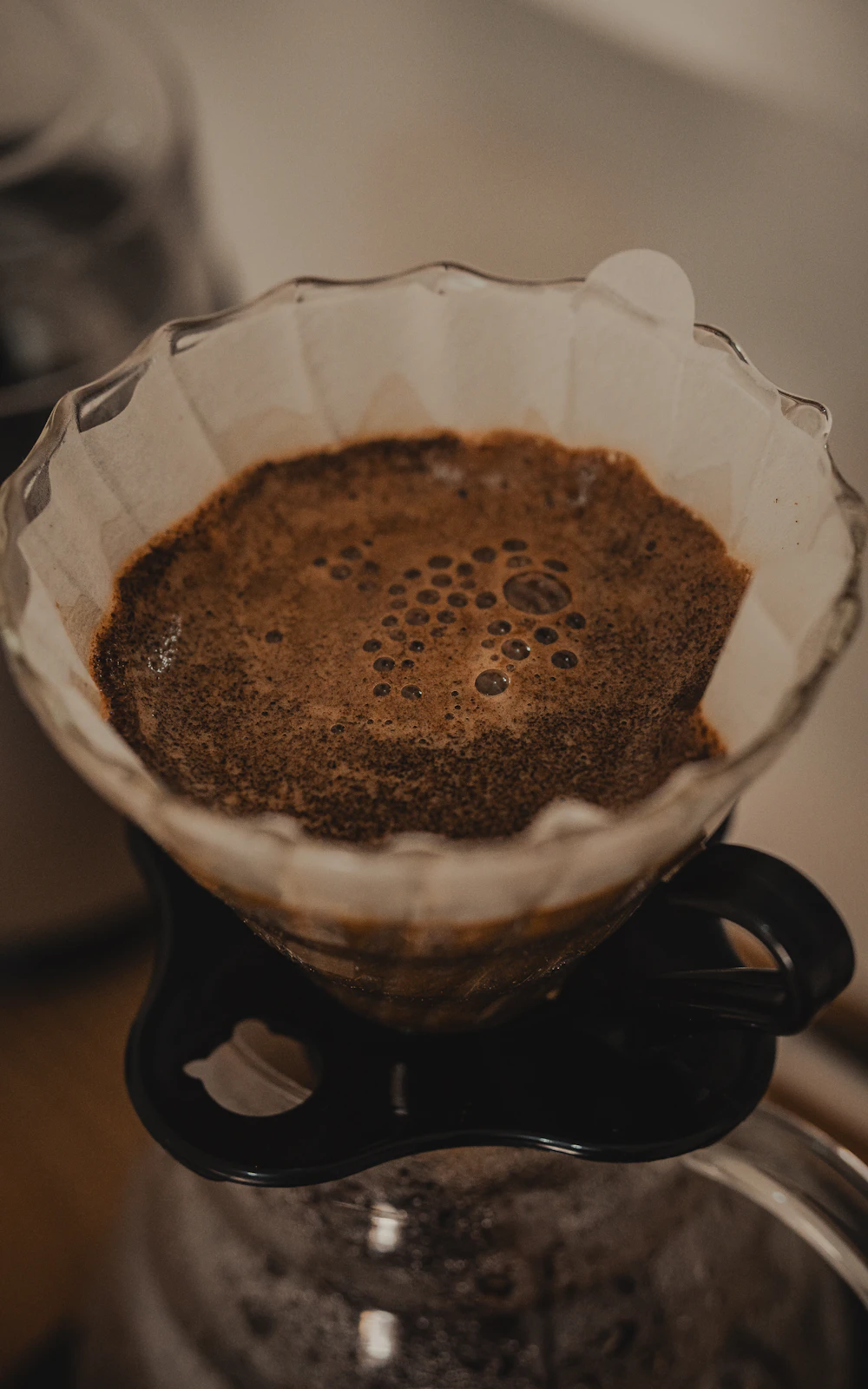Observing a V60 coffee bed before adjusting the next brew