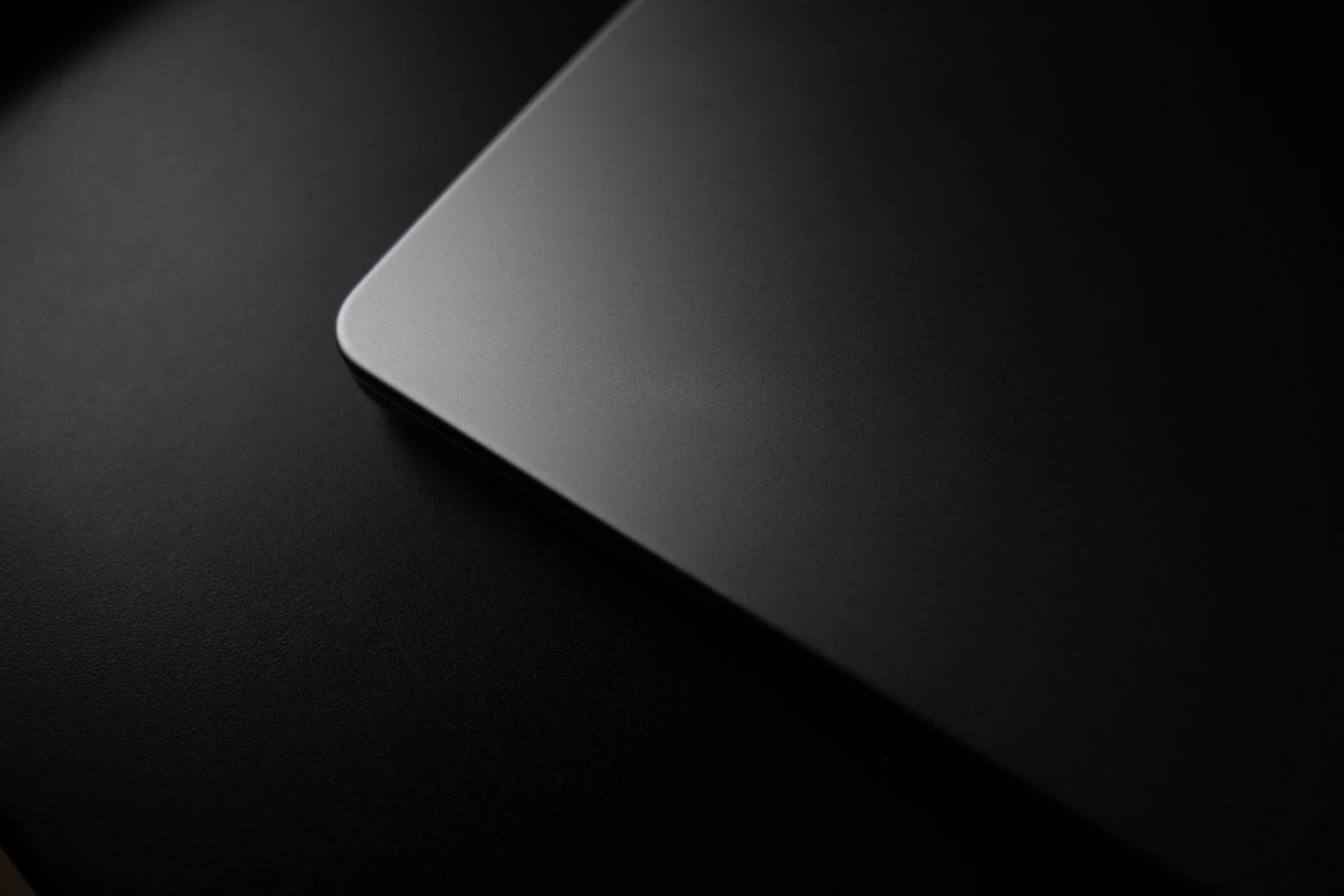 A dark, angular design on a surface.