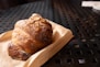 Delicious almond croissant on a table.
