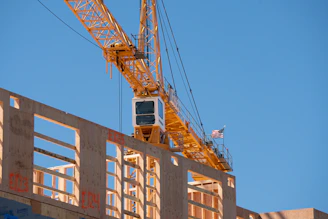 Construction crane over an unfinished building.