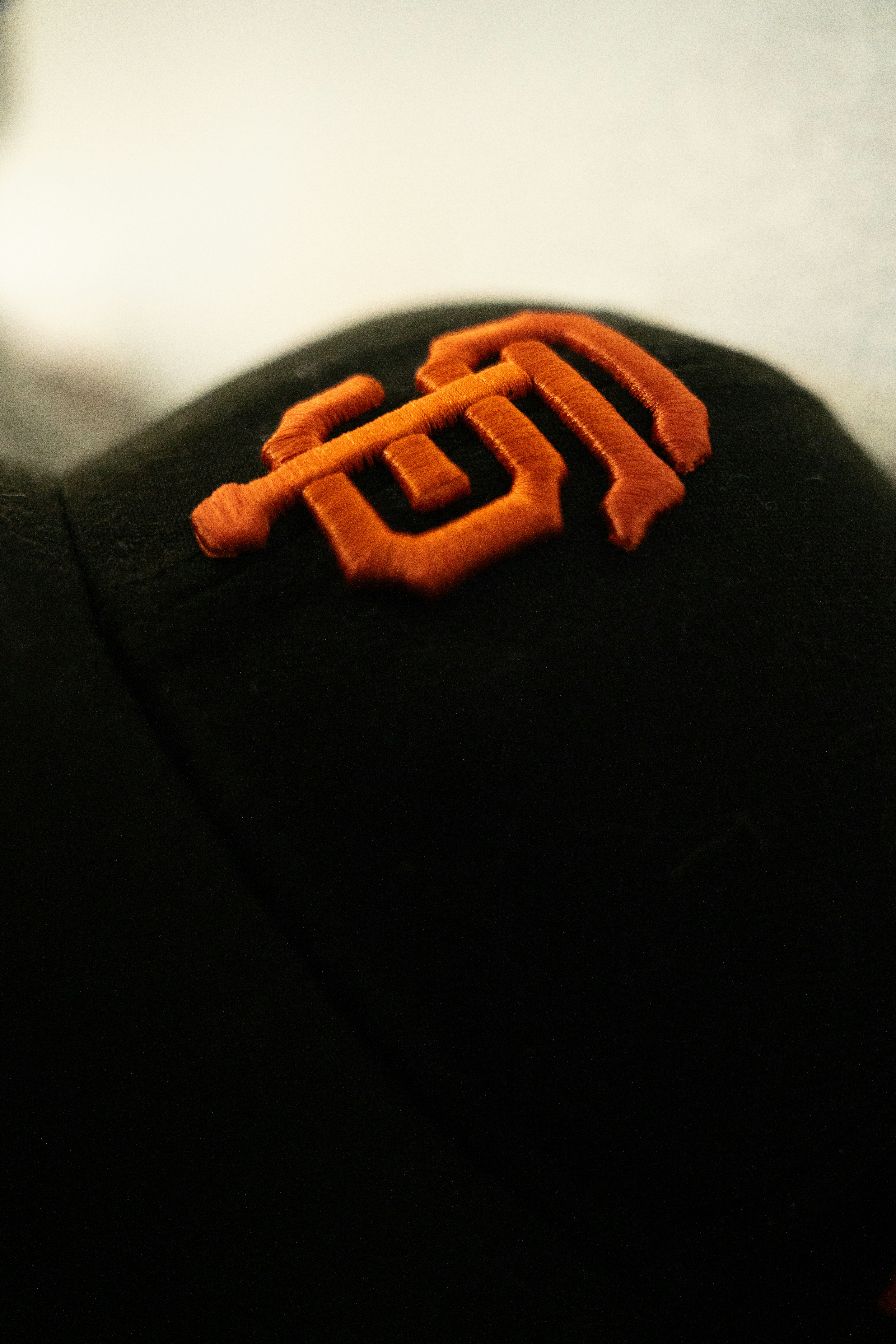 A san francisco giants cap is shown.
