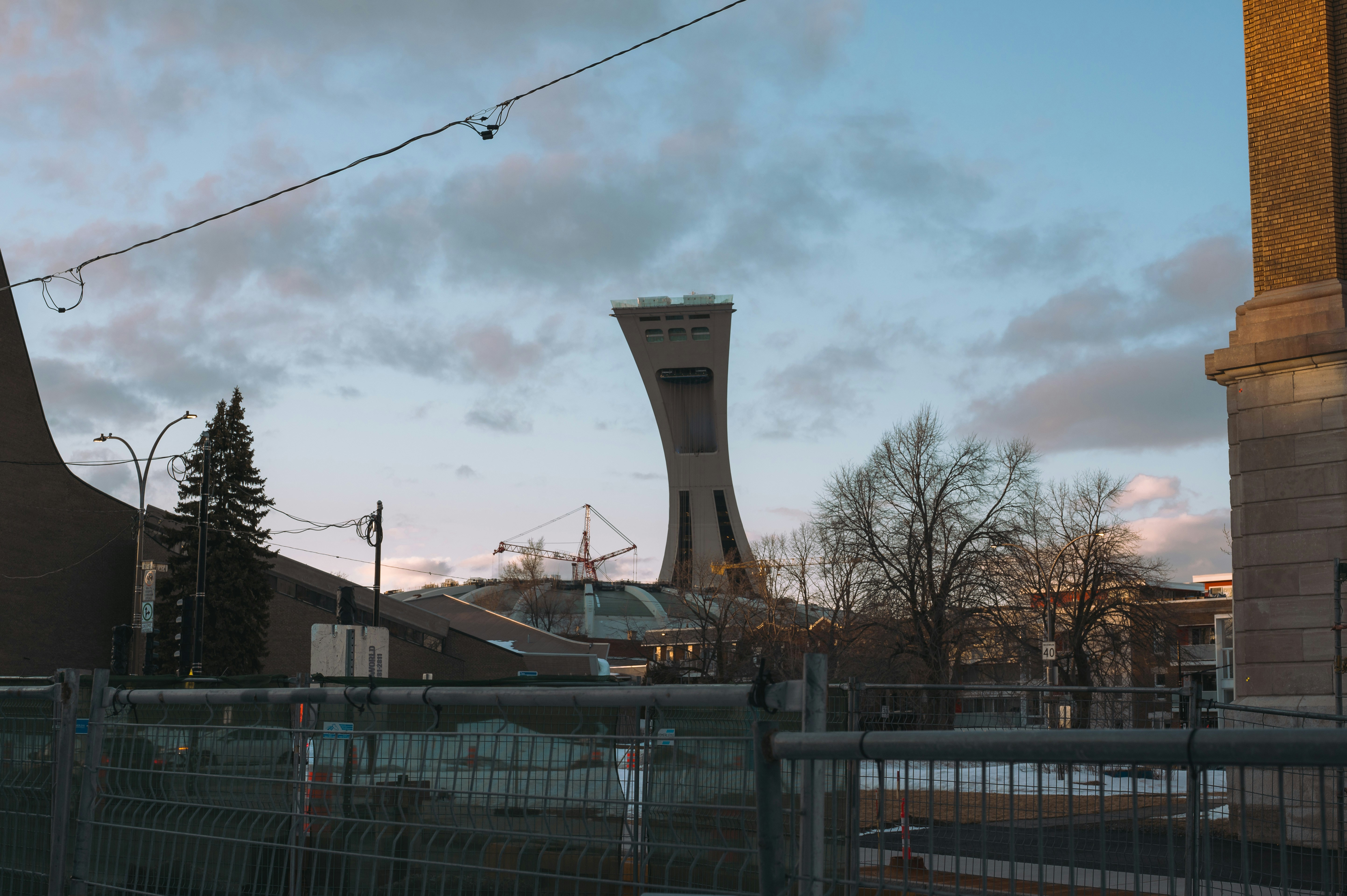 The montreal tower stands tall against the sky.